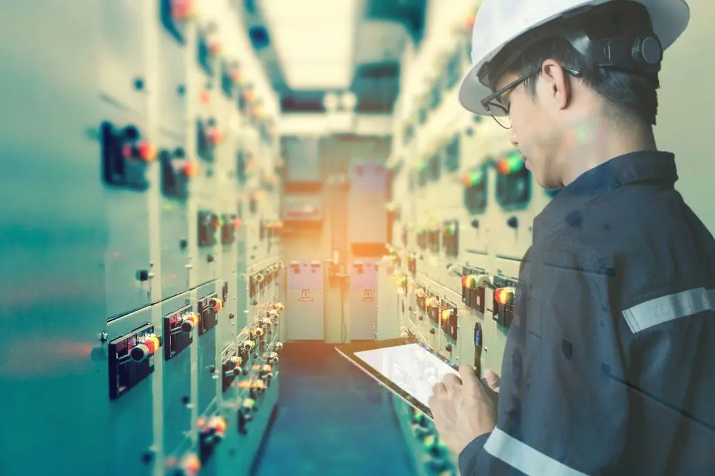 Engineer holding a tablet.