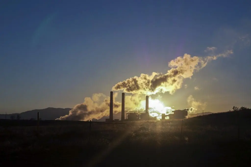 Smoke coming out of a building at night.