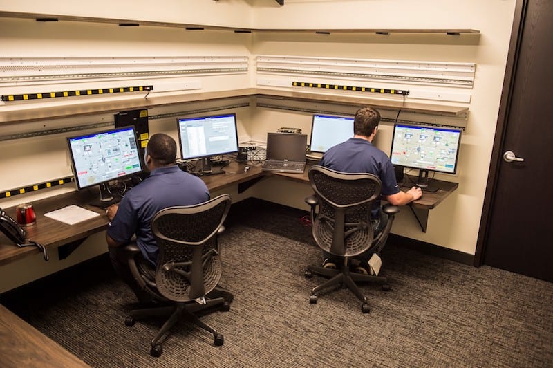 Two Wunderlich-Malec employees working at computers.