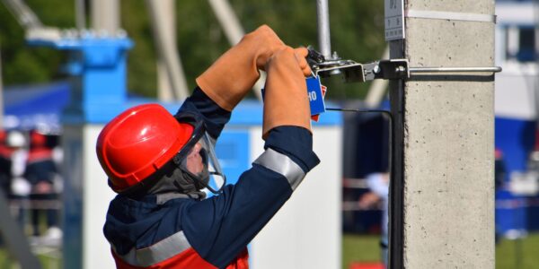 Electrical worker outside working.