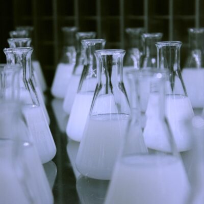 Flasks containing white liquid.